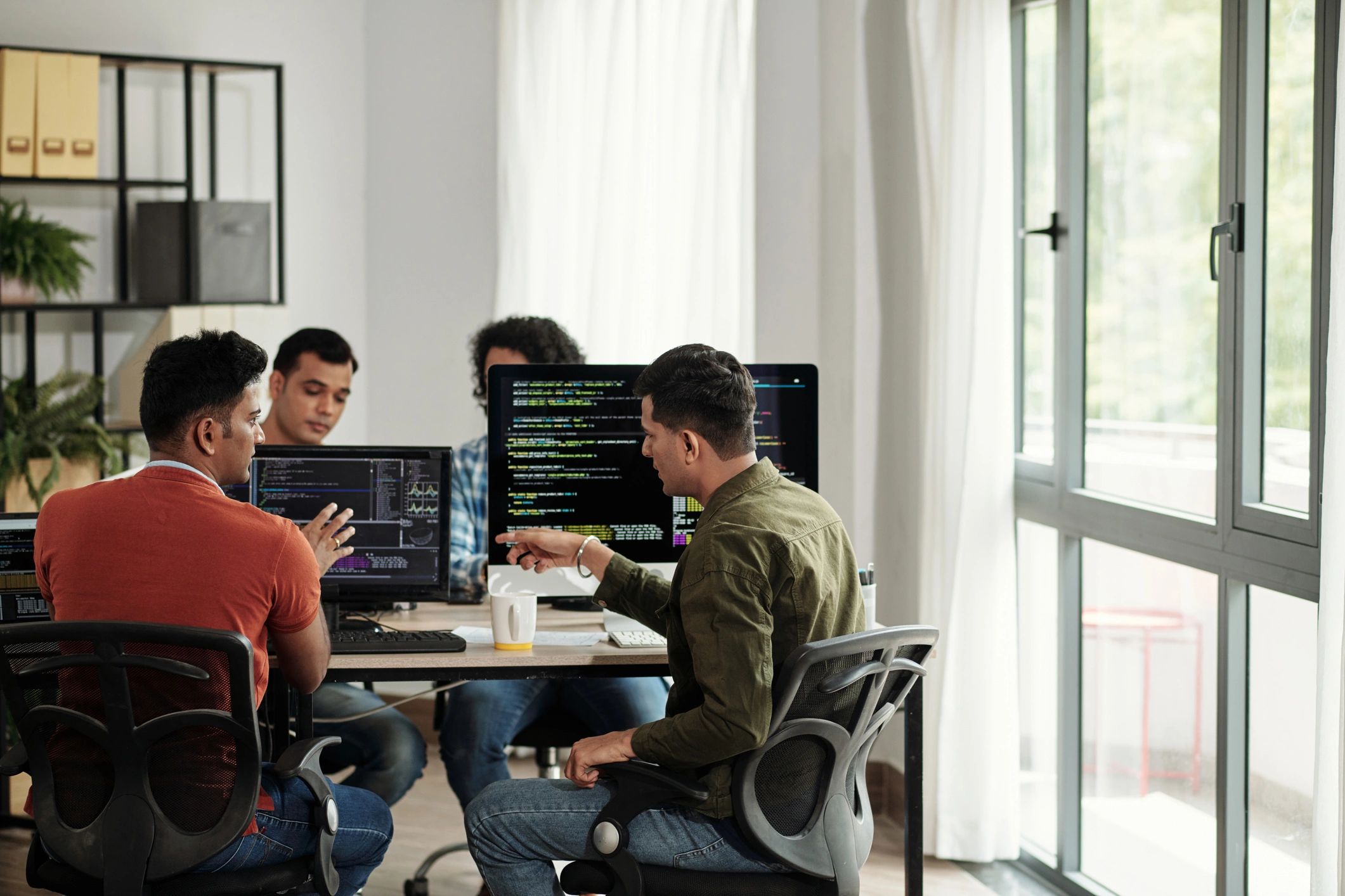 IT professionals discussing software and systems planning