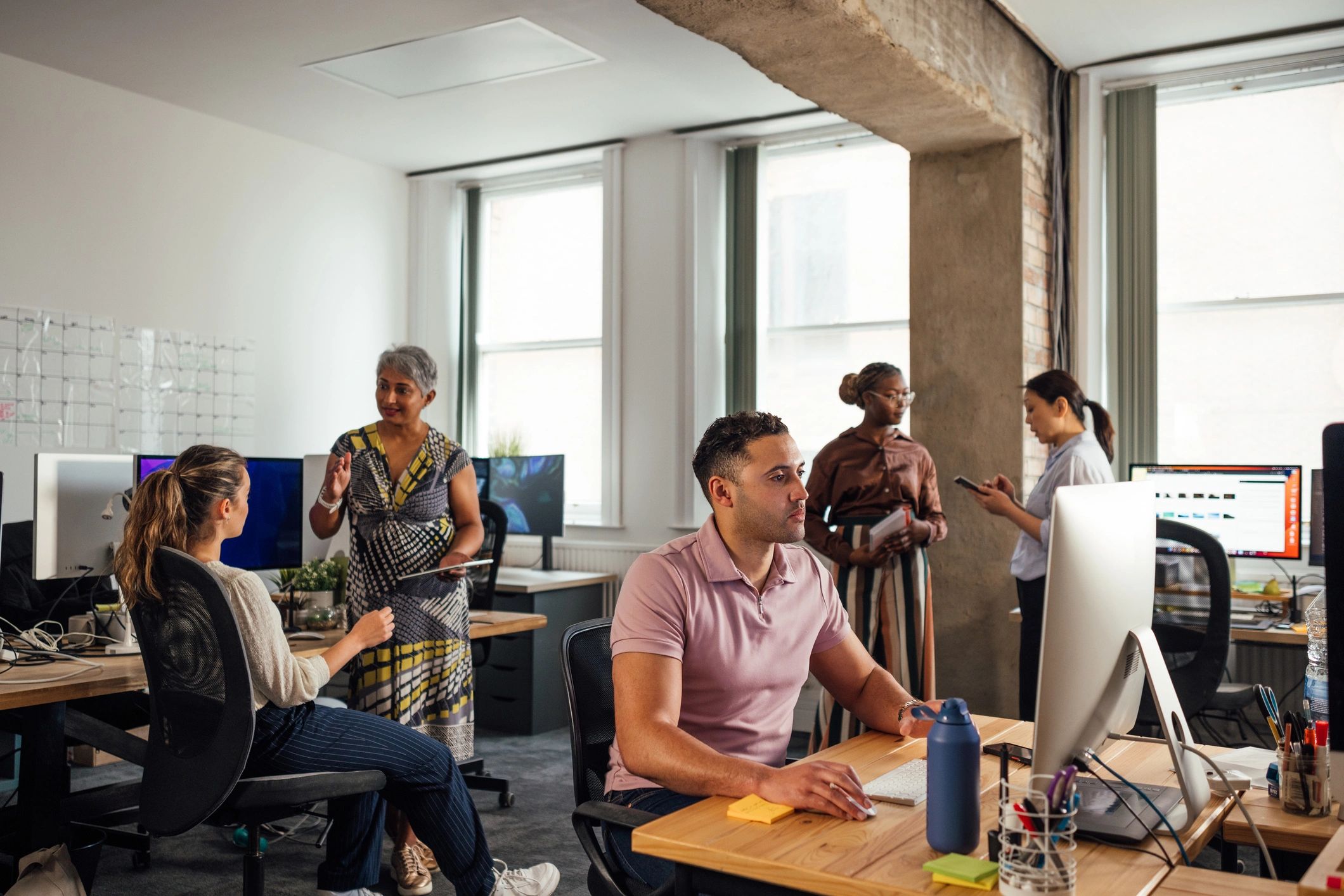 IT professionals working together in an office environment
